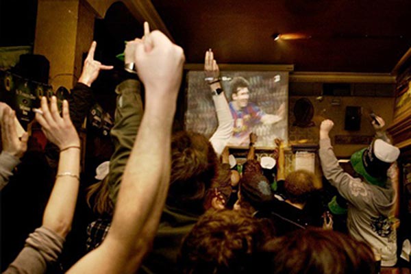 People celebrating a goal at Flaherty's Irish Bar in Barcelona